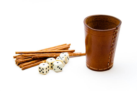 Dice cup with saltsticks and ballpoint pen