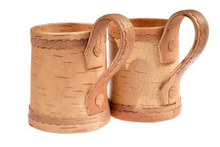 wooden mugs for beer on white backgroundの写真素材