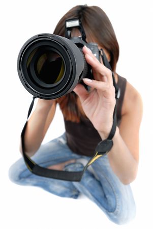 photo shoting .... girl with photo by camera on white backgroundの写真素材