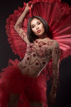 Young model posing in dancing outfit, red hatの写真素材
