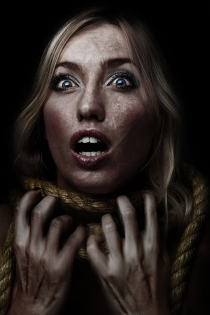 woman with rope tied on neck, studio shot