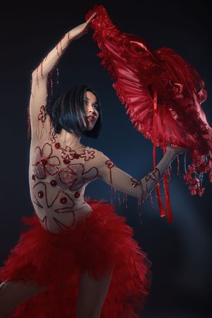 Young model posing in dancing outfit, red hatの写真素材