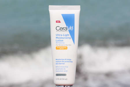 close up of a famous brand Cerave moisturizing lotion with spf protection. A tube is at the seaside in front of the waves. Batumi, Georgia country- June 2021のeditorial素材