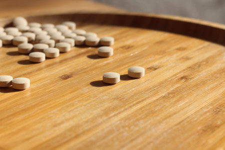 Group of white pills on the table. Medical healthcare theme