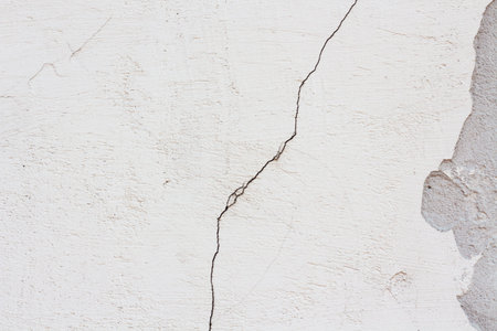 Bright white cracked old wall background for copy space.