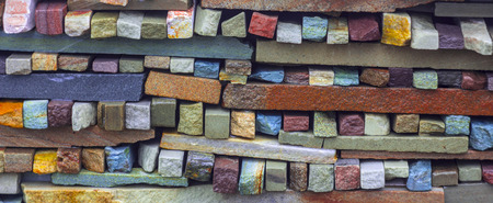 Fragment of artistic wall made with multiple stonesの写真素材