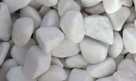 Polished colored marble pebbles and semi-precious stones background