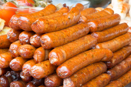 Grilling sausages on barbecue grill. Selective focusの写真素材