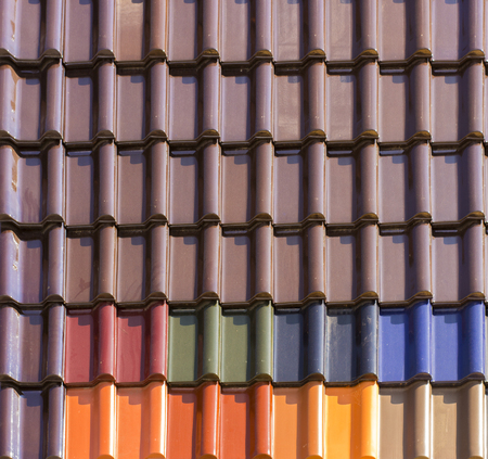 Red plastic roof tiles home texture close upの写真素材