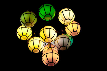 The street lamp in the form of bunches of different colors of round form.