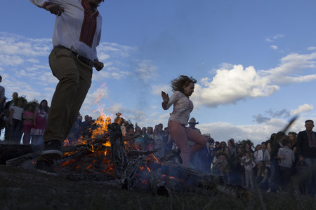 KYIV, UKRAINE - JULY, 6, 2017: Celebration of Ivan Kupala in Pirogovo. People dance, make wreaths and jump over the fire.のeditorial素材