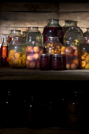 home preservation in a dark cellar in which breaks through several rays of lightの写真素材