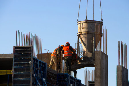 Concrete pouring during commercial concreting floors of building in construction site and Civil...