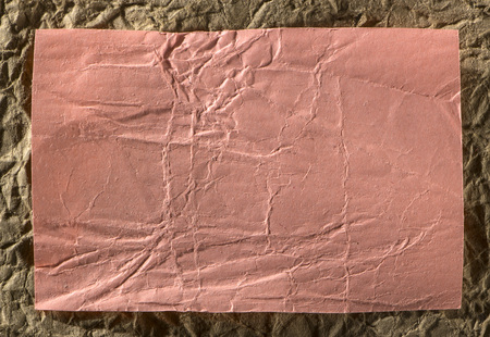 Red crumpled Wrinkled Paper Texture for background.の写真素材