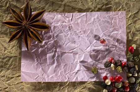 Texture with a place to write a recipe, crumpled paper and spices close upの写真素材