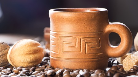 grains of coffee, cuddly cookies on a wooden background. Photography in low key.の写真素材