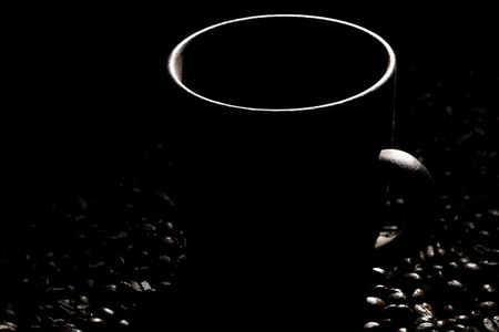 clay cup with coffee on the background of grains backgroundの写真素材