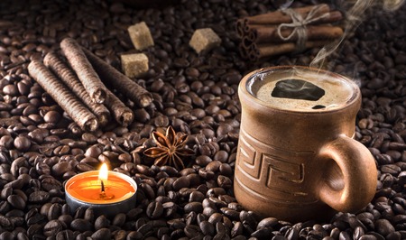 Retro Cup of coffee with foam. Rustic clay dishes. Delicious morning coffee.の写真素材