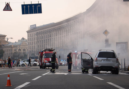 July 15, 2015. Independence Square Kyiv: Fire extinguishes an outbreak of a car near the trade...