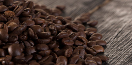 roasted coffee beans on wood texture