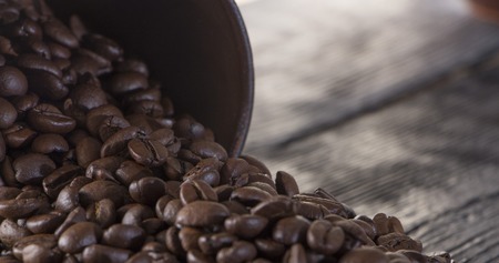roasted coffee beans on wood textureの写真素材