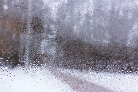 Blue water drops on window glas backgroundの写真素材