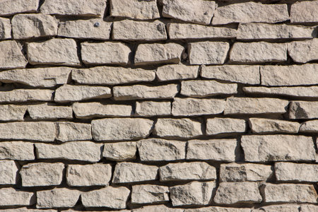 Dry stone wall texture background close up