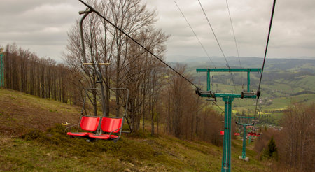 Many empty ski lift chairs in a row close up in the summerの写真素材