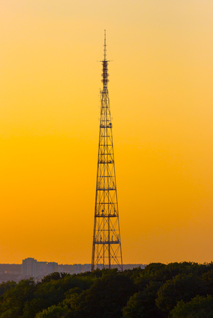 The sunset over the city is a bright orange sky, and lustrous clouds.の写真素材