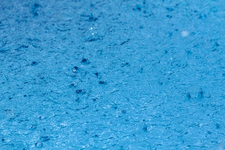 Background of water in swimming pool. Surface of blue swimming pool. Close-upの写真素材