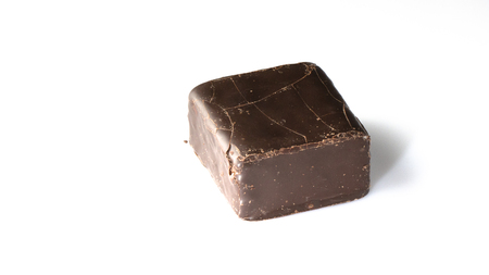 Square candy cane with cracks on the surface, on a white background, top viewの写真素材