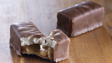 Chocolate candies on a wooden background. Close-upの写真素材