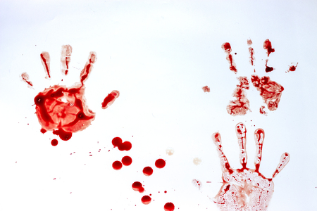 Red imprint of the bloody palm on a white background close upの写真素材