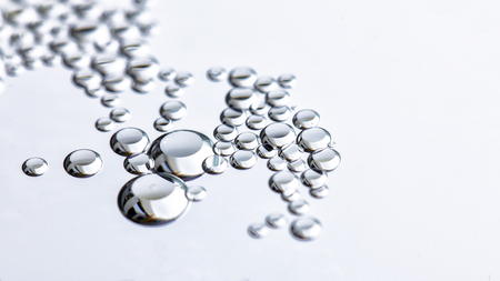 Close up Water drops with Rainbow colorful backgroundの写真素材