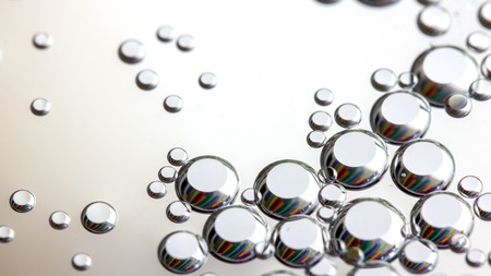 Close up Water drops with Rainbow colorful backgroundの写真素材