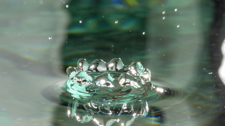 Drops of rain fall into the water, selective focus close upの写真素材