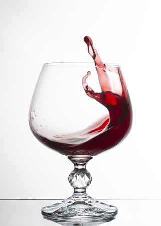 A glass of white wine on white background close-up still life imageの写真素材