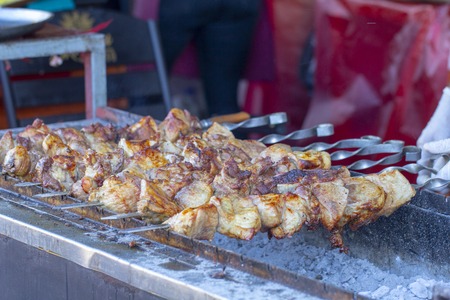 Street food, grilled meat on a spit. Homemade. Close upの写真素材