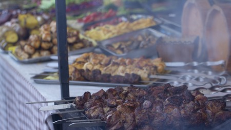 Street food, grilled meat on a spit. Homemade. Close upの写真素材
