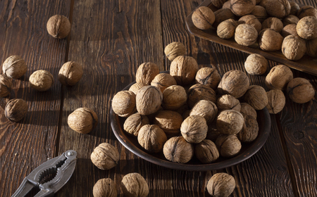 Shelled walnuts. On a wooden table. Top view close upの写真素材