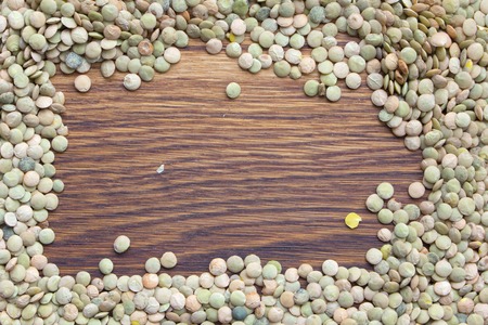 Natural organic green lentils for healthy food in wooden backgroundの写真素材