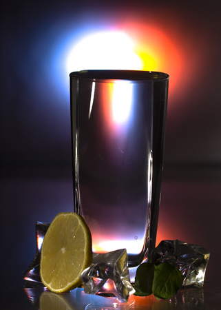 Gin and Tonic drink served with ice, lemon zest and fresh rosemary. Dark styleの写真素材