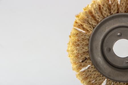 Sisal circle for angle grinder, used for polishing wood and metals, on white backgroundの写真素材