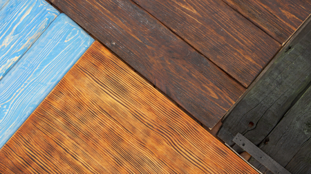 Multicolored wooden surface with old faded paint texture top wievの写真素材