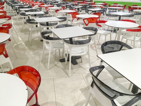 Many empty plastic tables in the open cafe.の写真素材