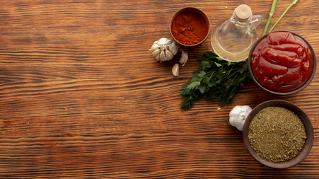 Composition with different spices on wooden backgroundの写真素材