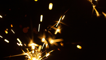 Christmas sparkler isolated on black background. Bengal fire close upの写真素材