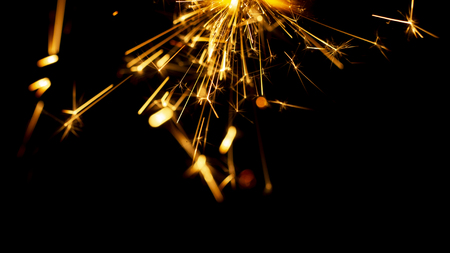 Christmas sparkler isolated on black background. Bengal fire close upの写真素材