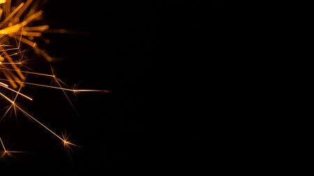 Christmas sparkler isolated on black background. Bengal fire close up