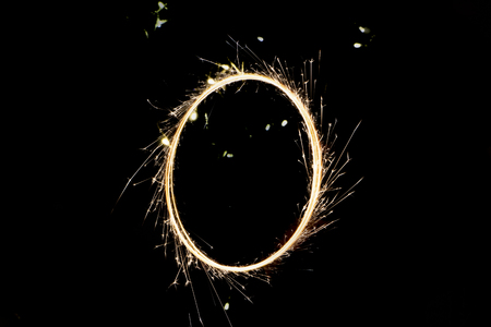 beautiful sparkler in a circle on a black background close upの写真素材